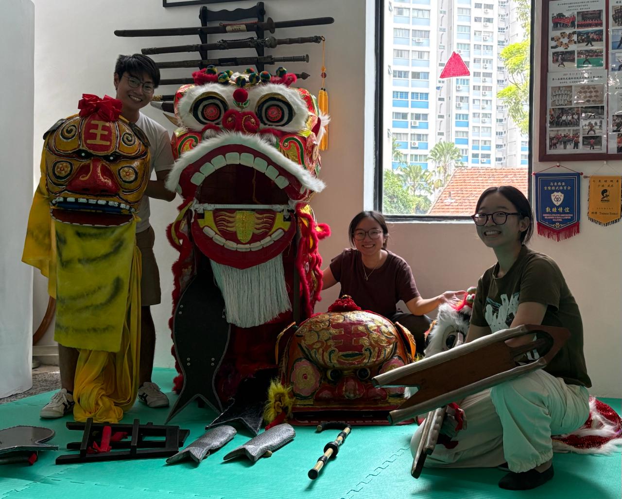 The Hainanese Cooked team — Wee Liang, Chuen Shin and V-Nying — with a lion-dance troupe