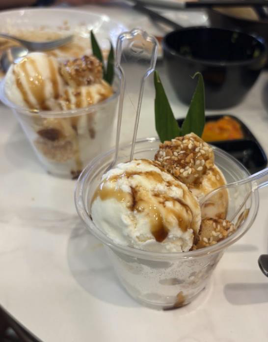 Cups of yibua ice cream topped with peanuts and gula melaka