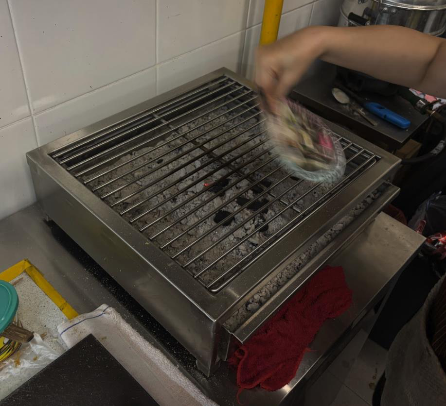Kaya and butter toast being roasted over a charcoal grill